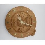 Colin Beaverman Almack - circular oak wall clock with a central carved Yorkshire Rose and brass