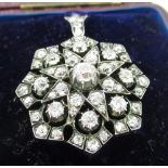 Victorian star brooch/pendant set with 54 bright cut diamonds, set in white metal backed with yellow