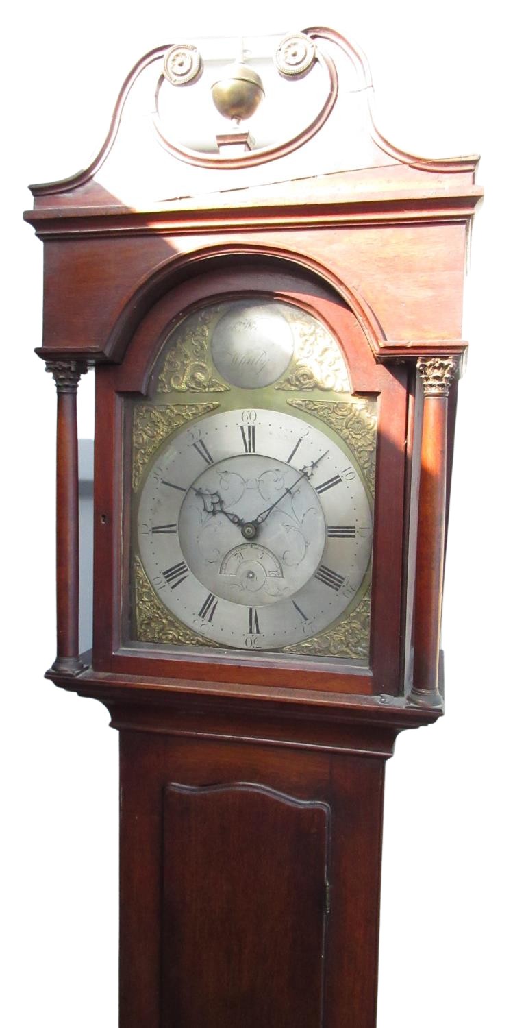 Early C19th mahogany long cased clock, swan necked pediment with ball and spire finial, arched brass