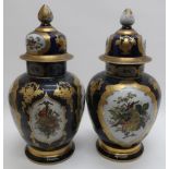 Pair of large early 20th C Meissen vases and covers, the ovoid bodies painted with panels of