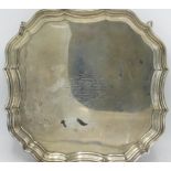 Geo.V hallmarked silver shaped square salver, with raised Chippendale style border on four scroll