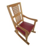Robert Mouseman Thompson - oak rocking chair with interlaced double splat and brass nail ox blood