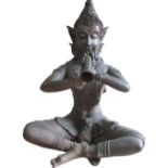 C20th hollow bronze figure of Phra Aphai Mani seated cross-legged, playing a magic flute W47cm D35cm