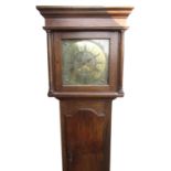 Late C18th oak long case clock, flat topped hood with turned columns, Roman dial with Arabic five