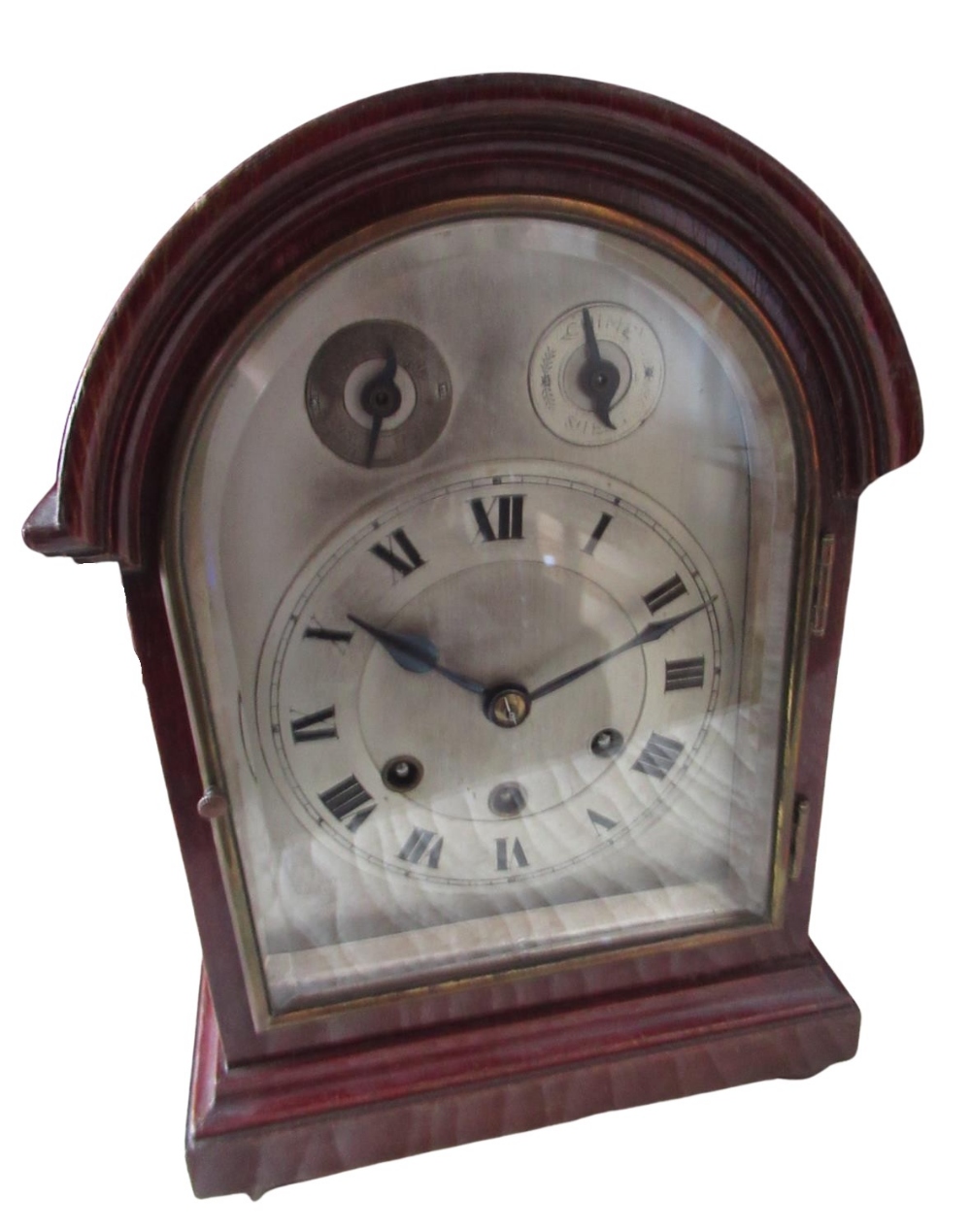 C20th arched top mahogany cased bracket clock, silvered dial with Roman chapter and subsidiary