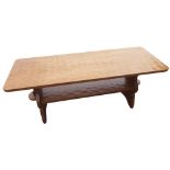 Thomas Gnomeman Whittaker - an oak two tier coffee table with rectangular adzed top and under tier