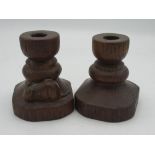 Robert Mouseman Thompson - pair of turned oak dwarf candlesticks, tapering octagonal bases carved