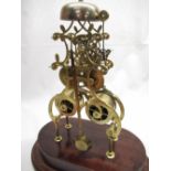 C20th scratch built brass skeleton clock, open work scrolled frame with twin train fusse movement