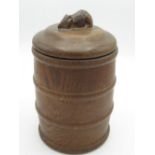 Robert Mouseman Thompson - turned oak biscuit barrel, cylindrical body with four raised bands, the
