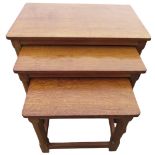 Robert Mouseman Thompson - nest of three oak rectangular tables, with adzed tops on faceted supports