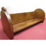 Robert Mouseman Thompson - oak bookrack on unusual arched end supports, carved with signature