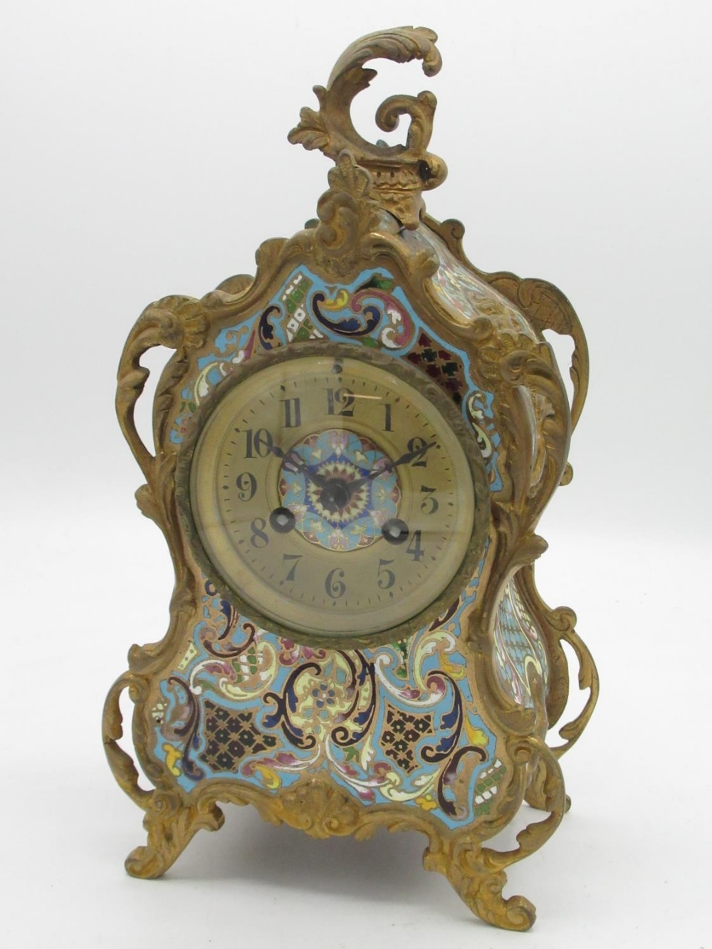 C20th French champlevé enamel and gilt metal rococo design clock, shaped case with scroll
