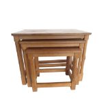 Robert Mouseman Thompson - nest of three rectangular oak tables with adzed tops on octagonal