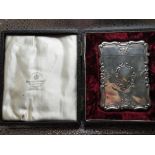 Victorian hallmarked silver rectangular card case, repousse decorated with cartouche C scrolls and