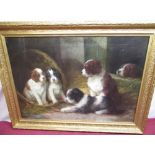 G. Decauills (C19th); Spaniel puppies in a stable interior, oil on canvas, indistinctly signed, 48cm