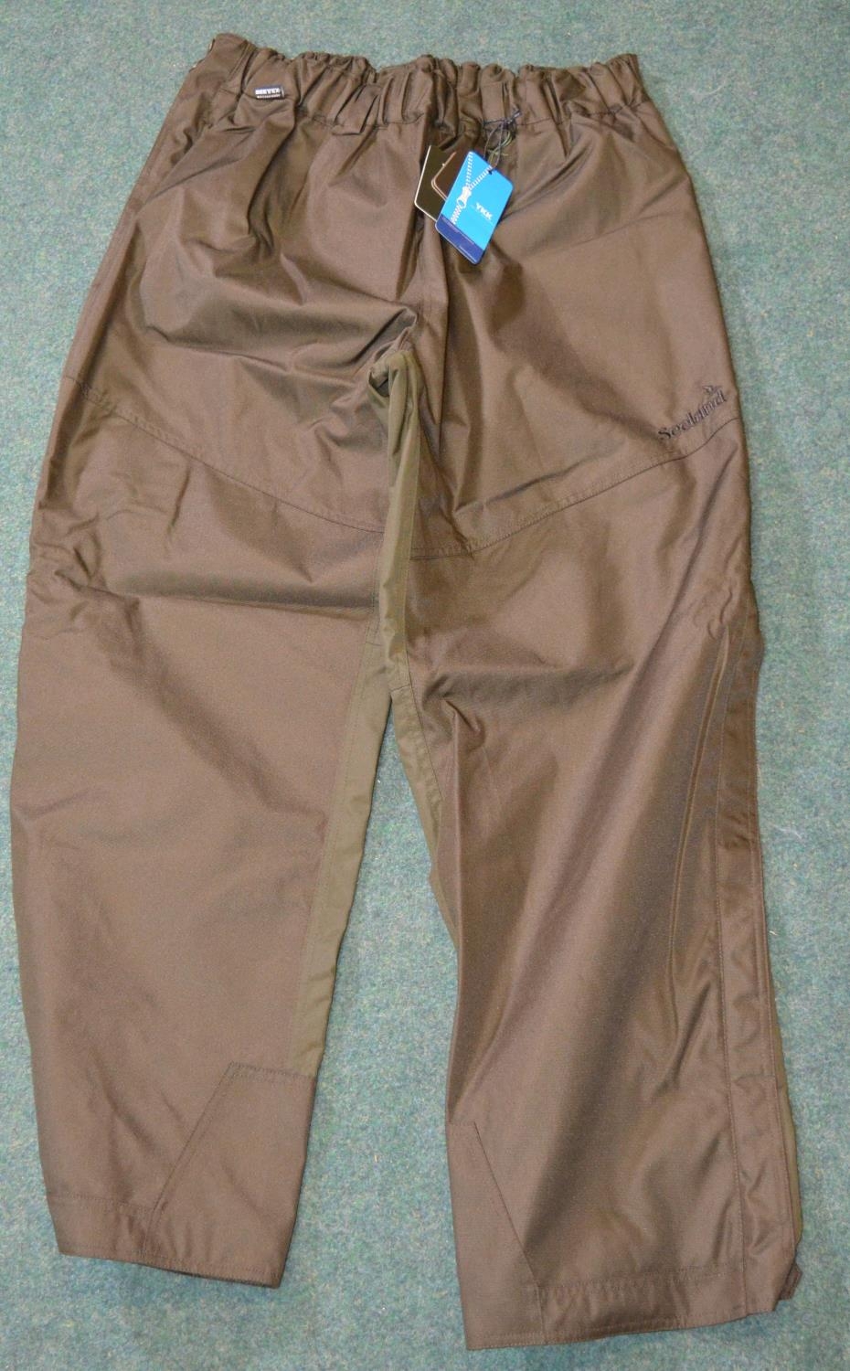 Pair of Bonart olive green overtrousers, size medium, pair of Harkila braces, pair of Alan Paine