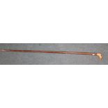 Walking stick with hazel shank and carving of ferret handle with glass eyes L132cm