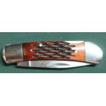 Single bladed pocket knife with textured wooden handle