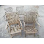 Five Teak folding teak garden chairs with slatted seats and backs