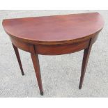 George III rosewood banded and boxwood strung mahogany folding tea table, on twin gate action square