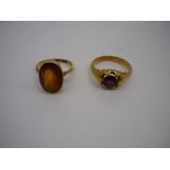 18ct gold hallmarked ring, claw set with garnet and a 18ct gold opal topaz ring (2) 11.8g gross