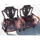 Pair of Chinese zitan hardwood throne type chairs, scroll backs with pierced and carved splat joined