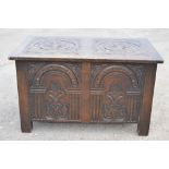 C17th style oak blanket box carved with arcades and stylised foliage W81cm D50cm H47cm