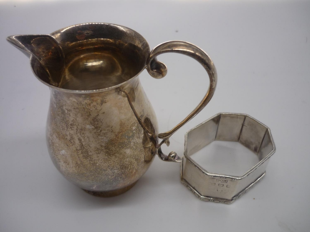 Geo.V hallmarked silver sparrow beak cream jug, Birmingham 1938 and an octagonal napkin ring,