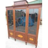 Edwardian satinwood crossbanded mahogany display cabinet with stepped cornice above three astragal