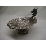 Silver plated shell shaped nut bowl, with decorative scroll shaped squirrel handle. H22cm L26cm