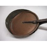 Late C19th shallow copper saucepan with riveted wrought iron handle and matching copper lid. D32cm