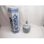 Orientals stick stand with images of a swallow, dragons and fish and a blue and white lamp