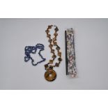 Tiger's eye necklace, 101.9g, clasp stamped 925, a blue amethyst necklace, 31.4g and a string of