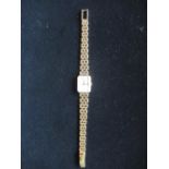 Ladies Longines 18K quartz wristwatch rectangular gold case on tapering tear drop bracelet stamped