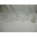 Collection of cut glass port and sherry glasses, whiskey tumblers, brandy glasses etc