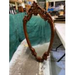 Rococo style wall mirror with in scroll carved frame