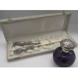 Pair of Edwardian ivory glove stretchers with repoussé decorated silver hallmarked handles by