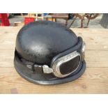 Black fibreglass military style helmet with associated goggles
