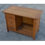 Contemporary oak dressing table with three drawers and a single overhang shelf on square supports.