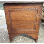 C18th and later oak enclosed stool, of planked construction with chip carved frame on shaped