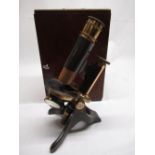Black japanned and brass monocular microscope by EG Wood, 74 Cheapside London, with screw fine