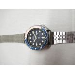 Seiko divers 150m quartz wristwatch with day date, rotating. Stainless steel case with rotating