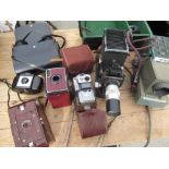 Selection of various cameras including a red leather covered Kodak portrait brownie no. 2, brown