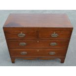 Small C19th mahogany chest of two short and two long graduated cockbeaded drawers with oval shaped