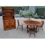 Reproduction oak cottage dining room suite comprising set of four Windsor type chairs, circular