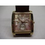 Seiko quartz wristwatch with day, date and 24 hour indicator. Rectangular gold-plated case on
