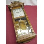 Continental 1930's cased wall clock, moulded medium oak case full length glazed and bevelled edge