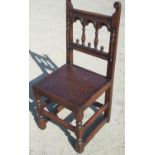 Charles II style oak back stool, baluster and arcade carved back with scroll cresting, solid seat on