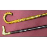 C20th bamboo walking cane with curved handle, and a late C20th walking stick with brass handle in