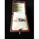 18ct gold amethyst ring set with octagonal amethyst, and six diamonds hallmarked stamped 750